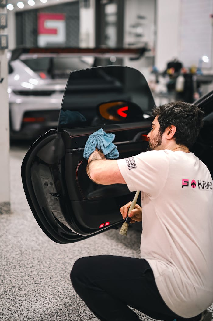 Man Wiping Car Door